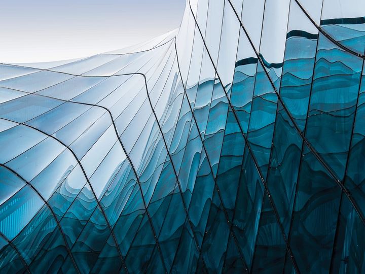 Close-up view of beautiful curved glass building